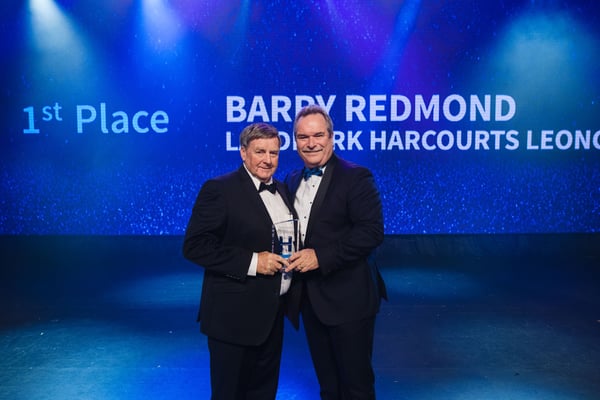 Barry Redmond receives the award for Top Rural Sales from Harcourts Managing Director, Mike Green